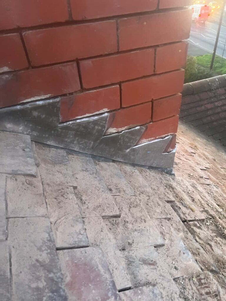 This is a photo of new leadwork being installed around an old chimney. Works carried out by Dinnington Roofing Repairs